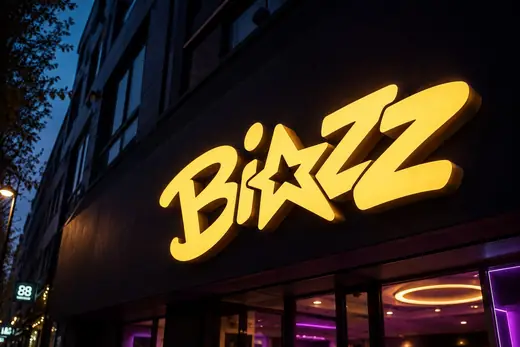Biazz: the yellow wordmark lit up as a sign above the club at dusk