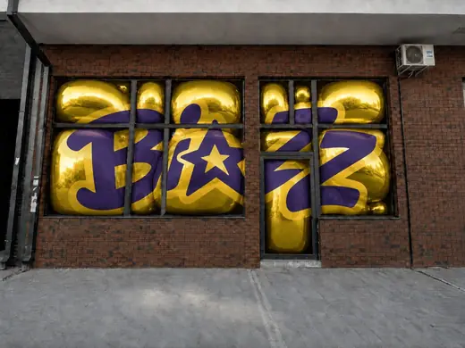 Biazz: shop windows covered in a yellow and purple wordmark print