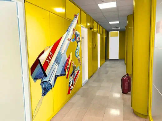 Epam / Vivify Ideas: Office corridor wall graphic with a spaceship, yellow version