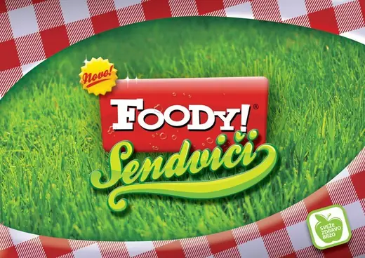 Foody! Restaurants: Foody! Sendviči sign on grass and a checked cloth