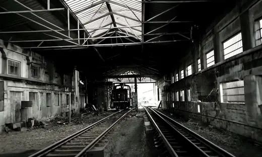 Marshaling Yard: A locomotive standing in the dark hall