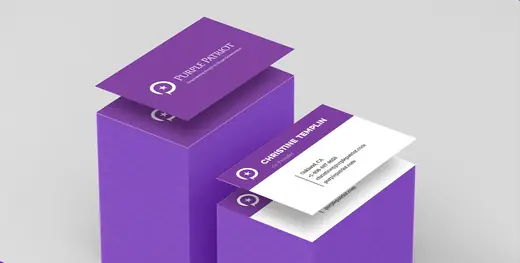 Stacks of Purple Patriot business cards in purple and white