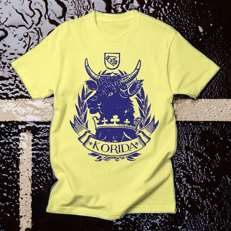 Neusatz: The Korida crest printed on a yellow T-shirt