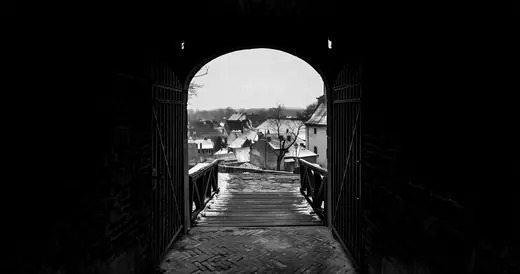 Peterwardein: A dark arched passage opening onto the town