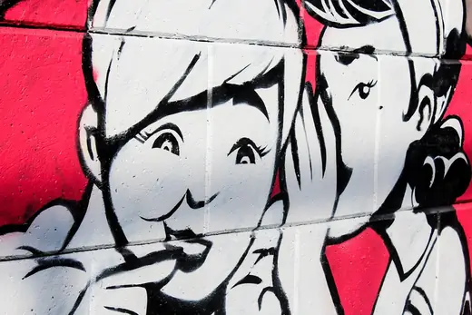mural showing two girls gossiping
