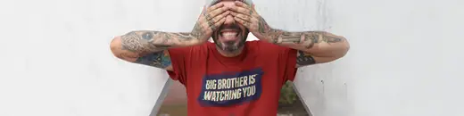 banner showing a man holding his hands over his eyes in a t-shirt saying big brother is watching you