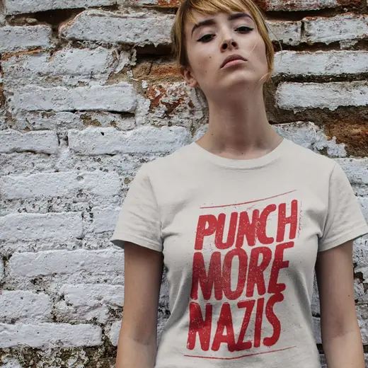 Propaganda Department: The Punch More Nazis tee worn against a brick wall