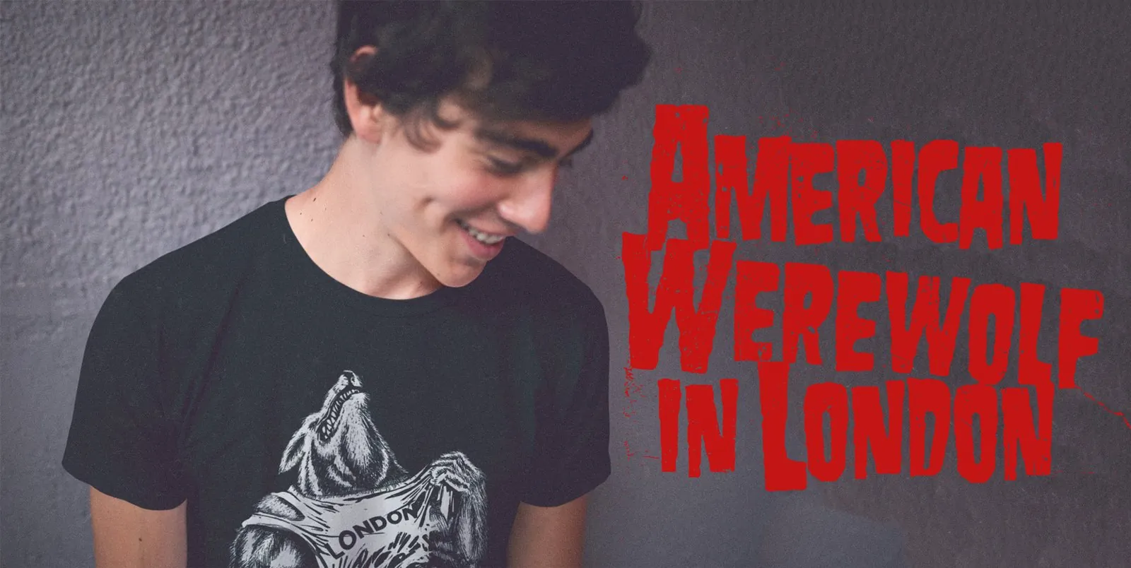 young man wearing tshirt on which werewolf is wearing tshirt with London text on it