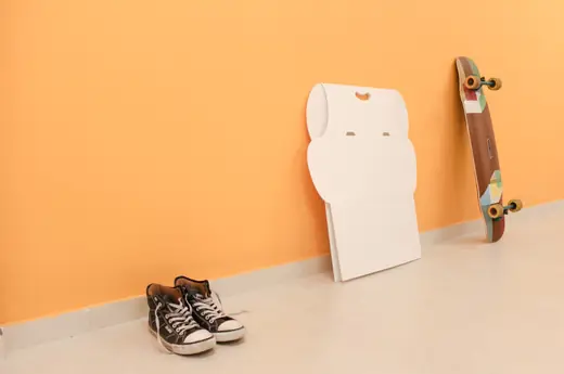 Standify: Folded desk against an orange wall