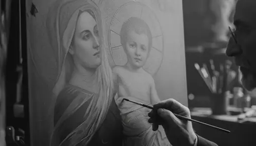 A painter’s brush on the Madonna and Child, close up