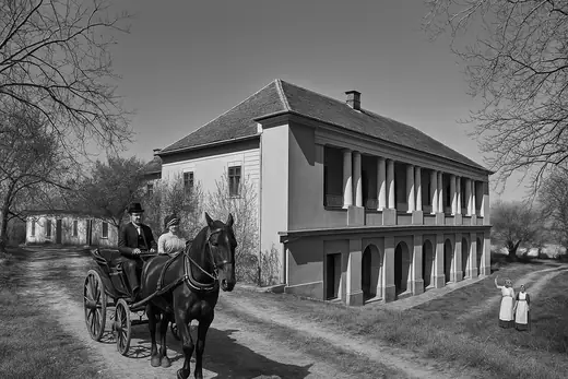 The Marczibányi-Karátsonyi Castle: A horse carriage passing the castle