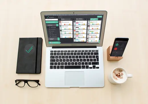VivifyScrum: VivifyScrum on laptop and phone, top view